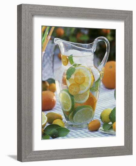 Jug of Water with Citrus Fruit, Lemon Balm and Ice Cubes-F. Strauss-Framed Photographic Print