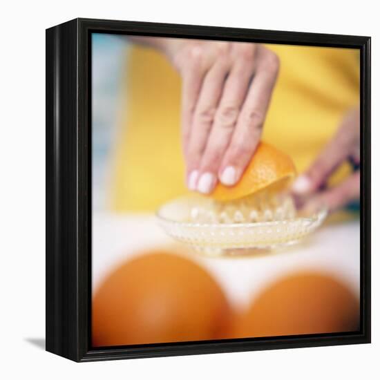 Juicing Oranges-Cristina-Framed Premier Image Canvas