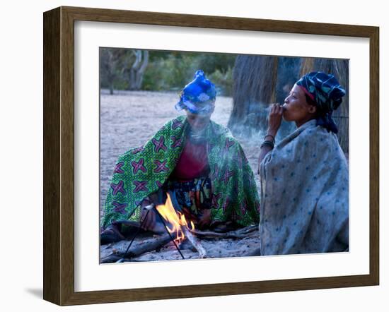 Jul'Hoan !Kung Bushman, Two Women Smoke around Fire in Village, Bushmanland, Namibia-Kim Walker-Framed Photographic Print