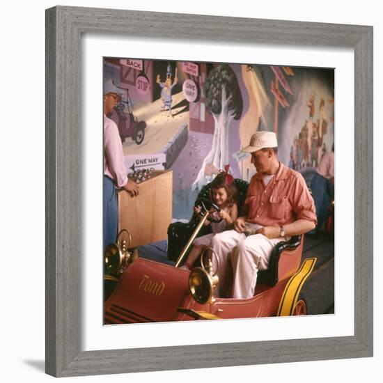 July 17 1955: Guests in the Mr Toad Wild Ride, Disneyland, Anaheim, California-Loomis Dean-Framed Photographic Print