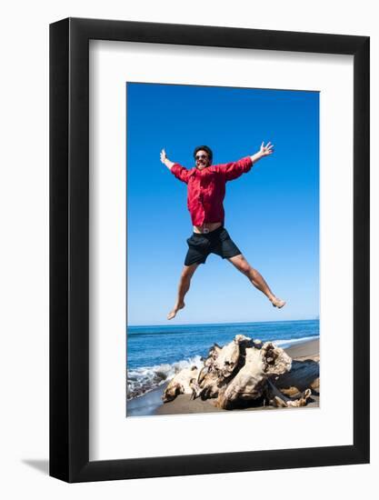 Jumping close to sea, Capalbio beach, province of Grosseto, Tuscany, Italy, Europe-Nico Tondini-Framed Photographic Print