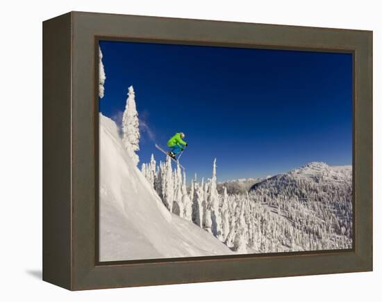 Jumping from Cliff on a Sunny Day at Whitefish Mountain Resort, Montana, Usa-Chuck Haney-Framed Premier Image Canvas