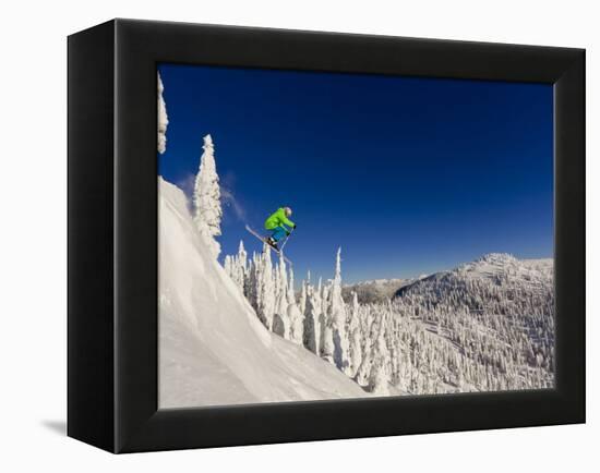 Jumping from Cliff on a Sunny Day at Whitefish Mountain Resort, Montana, Usa-Chuck Haney-Framed Premier Image Canvas