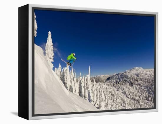 Jumping from Cliff on a Sunny Day at Whitefish Mountain Resort, Montana, Usa-Chuck Haney-Framed Premier Image Canvas