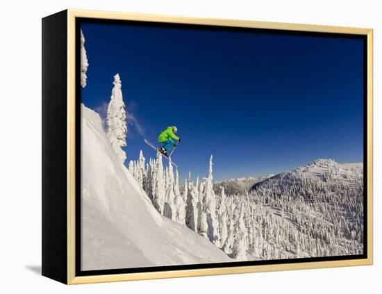 Jumping from Cliff on a Sunny Day at Whitefish Mountain Resort, Montana, Usa-Chuck Haney-Framed Premier Image Canvas