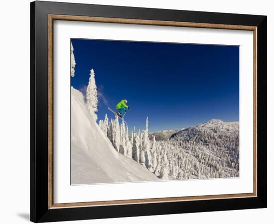 Jumping from Cliff on a Sunny Day at Whitefish Mountain Resort, Montana, Usa-Chuck Haney-Framed Photographic Print
