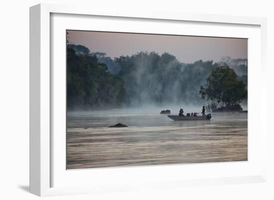 Kafue NP, Zambia. Tourist On A Boat Tour Of Kafue River Enjoys Morning Mist Before The Sun Rises-Karine Aigner-Framed Photographic Print