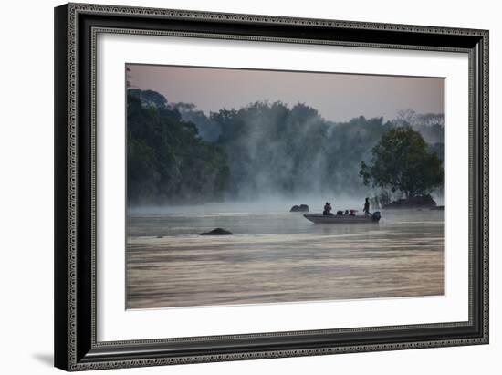 Kafue NP, Zambia. Tourist On A Boat Tour Of Kafue River Enjoys Morning Mist Before The Sun Rises-Karine Aigner-Framed Photographic Print