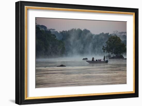 Kafue NP, Zambia. Tourist On A Boat Tour Of Kafue River Enjoys Morning Mist Before The Sun Rises-Karine Aigner-Framed Photographic Print