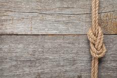 Ship Rope Knot on Old Wooden Texture Background-karandaev-Framed Photographic Print
