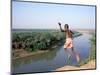 Karo Boy Leaps Off a Cliff Over the Omo River, Ethiopia-Janis Miglavs-Mounted Photographic Print