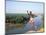 Karo Boy Leaps Off a Cliff Over the Omo River, Ethiopia-Janis Miglavs-Mounted Photographic Print