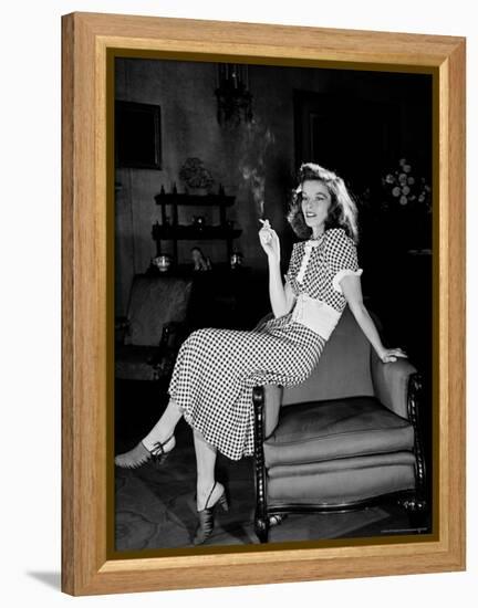 Katharine Hepburn in chair Smoking Cigarette in Scene from Broadway Show "The Philadelphia Story"-Alfred Eisenstaedt-Framed Premier Image Canvas