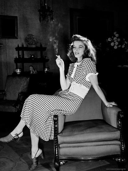 'Katharine Hepburn in chair Smoking Cigarette in Scene from Broadway