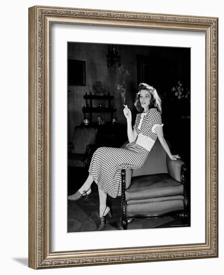 Katharine Hepburn in chair Smoking Cigarette in Scene from Broadway Show "The Philadelphia Story"-Alfred Eisenstaedt-Framed Premium Photographic Print