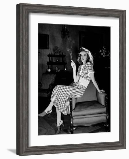 Katharine Hepburn in chair Smoking Cigarette in Scene from Broadway Show "The Philadelphia Story"-Alfred Eisenstaedt-Framed Premium Photographic Print