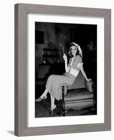 Katharine Hepburn in chair Smoking Cigarette in Scene from Broadway Show "The Philadelphia Story"-Alfred Eisenstaedt-Framed Premium Photographic Print