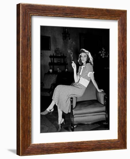 Katharine Hepburn in chair Smoking Cigarette in Scene from Broadway Show "The Philadelphia Story"-Alfred Eisenstaedt-Framed Premium Photographic Print