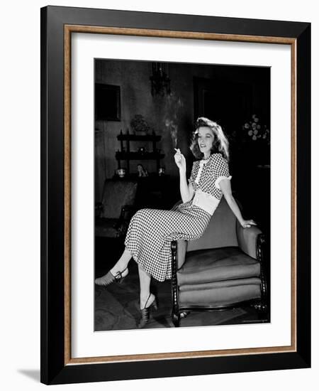 Katharine Hepburn in chair Smoking Cigarette in Scene from Broadway Show "The Philadelphia Story"-Alfred Eisenstaedt-Framed Premium Photographic Print