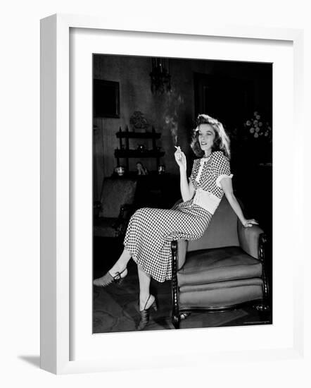 Katharine Hepburn in chair Smoking Cigarette in Scene from Broadway Show "The Philadelphia Story"-Alfred Eisenstaedt-Framed Premium Photographic Print