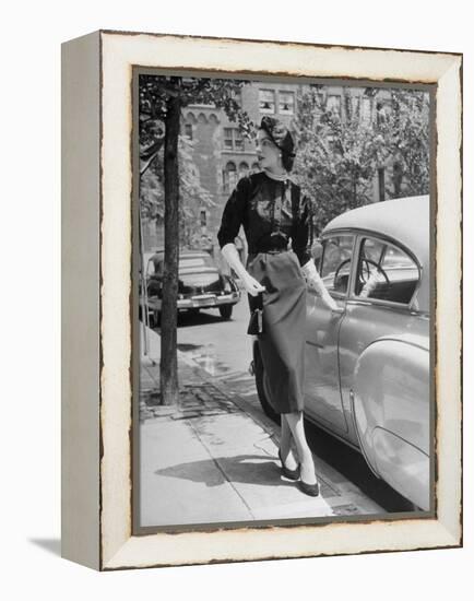 Katherine Cassidy Wearing a Red Fraostmann Wool Skirt and Black Sweater Beneath Black Cardigan-Nina Leen-Framed Premier Image Canvas