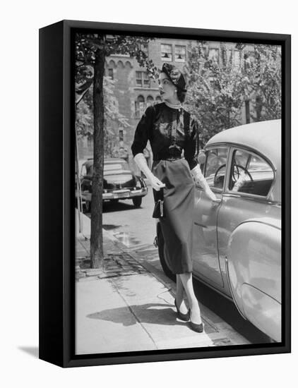 Katherine Cassidy Wearing a Red Fraostmann Wool Skirt and Black Sweater Beneath Black Cardigan-Nina Leen-Framed Premier Image Canvas