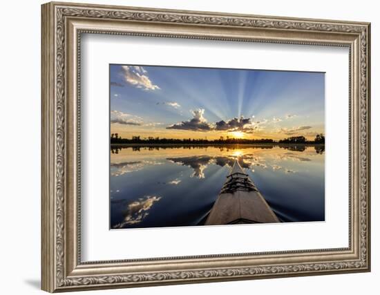 Kayaking into sunset rays on McWennger Slough, Kalispell, Montana, USA-Chuck Haney-Framed Photographic Print