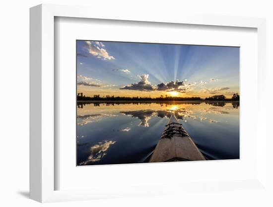 Kayaking into sunset rays on McWennger Slough, Kalispell, Montana, USA-Chuck Haney-Framed Photographic Print