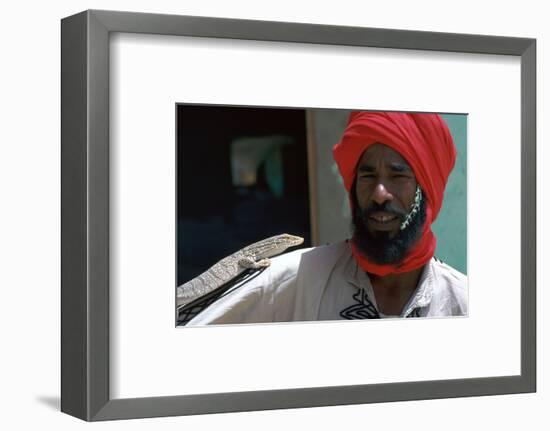 Keeper with a lizard in Tozeur zoo in Tunisia. Artist: Unknown-Unknown-Framed Photographic Print