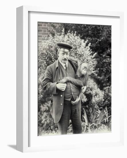 Keeper Z. Rodwell Holding Young Orangutan at London Zoo, October 1913-Frederick William Bond-Framed Photographic Print