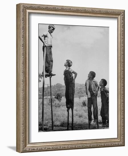 Kenneth Merriman on higher stilts than his brothers and friend-Robert W^ Kelley-Framed Photographic Print