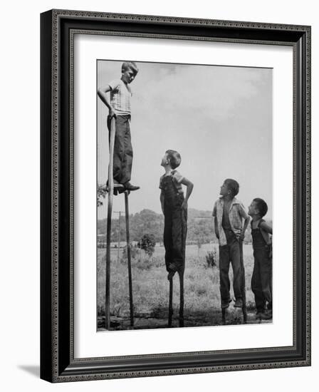 Kenneth Merriman on higher stilts than his brothers and friend-Robert W^ Kelley-Framed Photographic Print