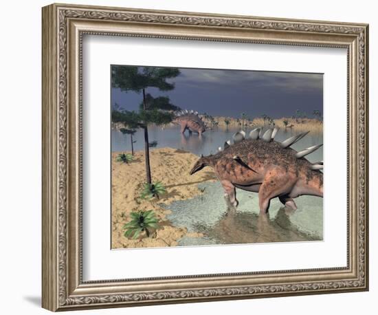 Kentrosaurus Dinosaurs Walking in the Water Next to Sand and Trees-null-Framed Premium Giclee Print