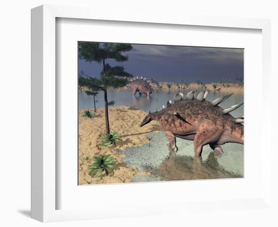 Kentrosaurus Dinosaurs Walking in the Water Next to Sand and Trees-null-Framed Premium Giclee Print