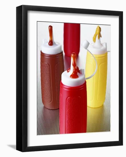 Ketchup and Mustard in Plastic Bottles-null-Framed Photographic Print