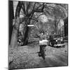 Kid Football Player Delivering Newspapers-Francis Miller-Mounted Photographic Print