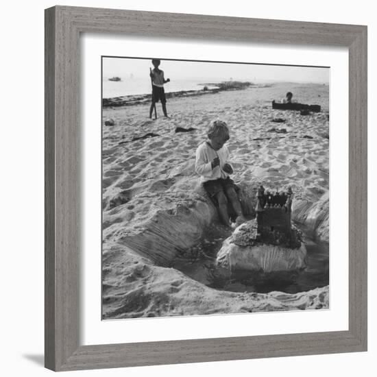 Kid Playing in Sand-Martha Holmes-Framed Photographic Print