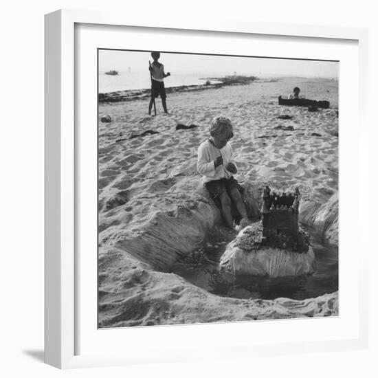 Kid Playing in Sand-Martha Holmes-Framed Photographic Print