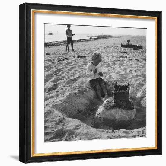 Kid Playing in Sand-Martha Holmes-Framed Photographic Print