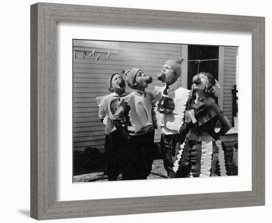 Kids Biting Apples on Strings at Halloween-null-Framed Photo