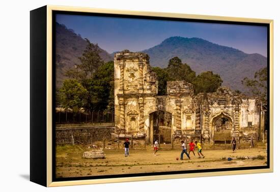 Kids Playing Soccer at Ruins in Antigua, Guatemala, Central America-Laura Grier-Framed Premier Image Canvas