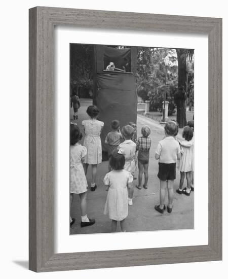 Kids Watching Outdoor Puppet Show-Dmitri Kessel-Framed Photographic Print