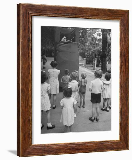 Kids Watching Outdoor Puppet Show-Dmitri Kessel-Framed Photographic Print