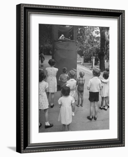 Kids Watching Outdoor Puppet Show-Dmitri Kessel-Framed Photographic Print