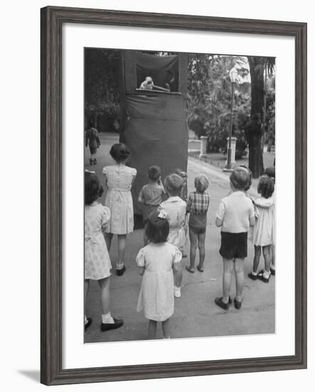 Kids Watching Outdoor Puppet Show-Dmitri Kessel-Framed Photographic Print