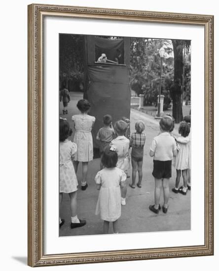 Kids Watching Outdoor Puppet Show-Dmitri Kessel-Framed Photographic Print