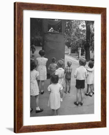Kids Watching Outdoor Puppet Show-Dmitri Kessel-Framed Photographic Print