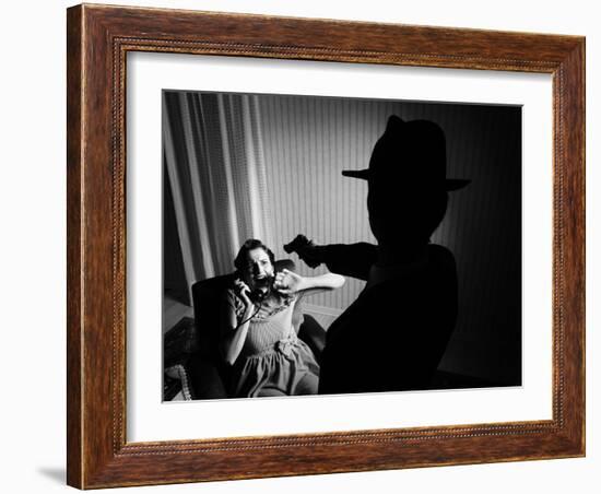 Killer Pointing the Gun at a Terrified Woman-stokkete-Framed Photographic Print