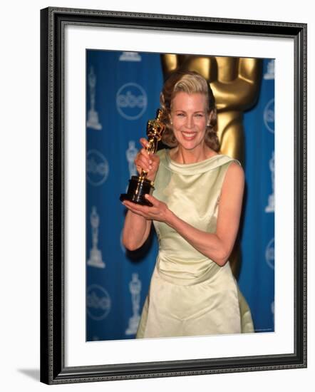 Kim Basinger Holding Her Oscar in Press Room at Academy Awards-Mirek Towski-Framed Premium Photographic Print