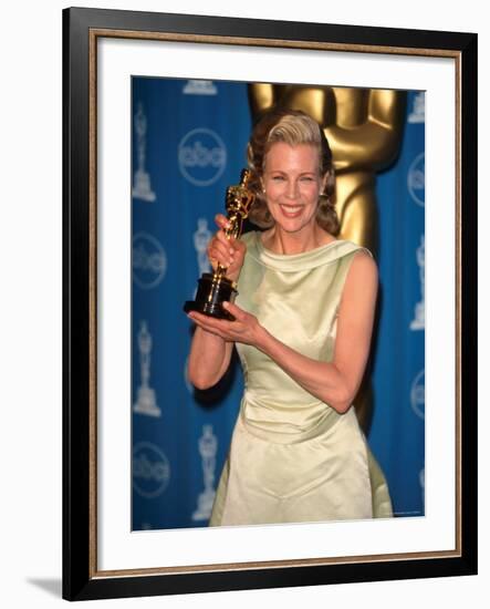 Kim Basinger Holding Her Oscar in Press Room at Academy Awards-Mirek Towski-Framed Premium Photographic Print